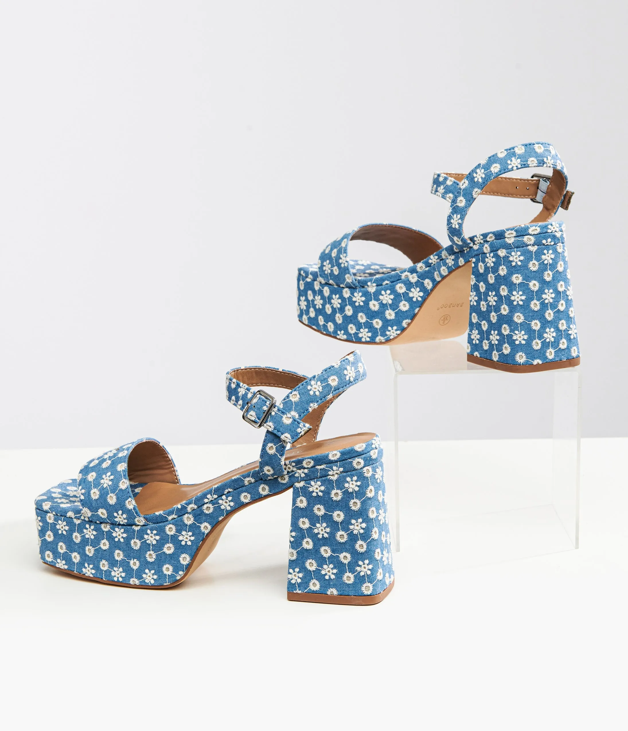 Blue daisy platform sandals from the 1970s in denim material