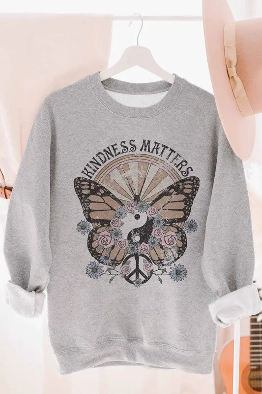 Graphic sweatshirt promoting kindness.